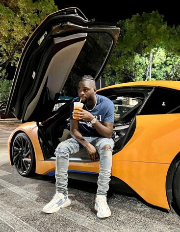 Odsonne Edouard posing with his car.
